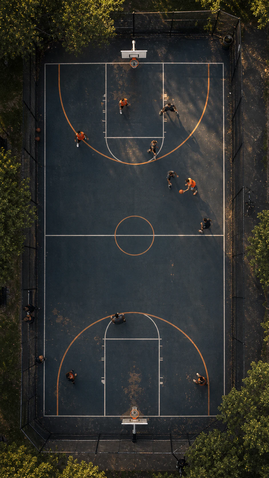 Bird's-eye view of players on an outdoor basketball court